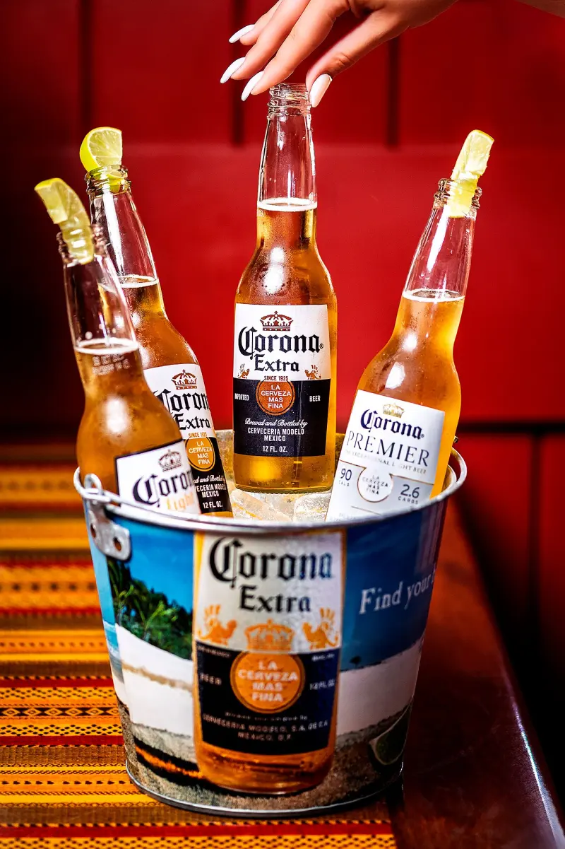 Bucket of iced Corona beers with lime for a bar promotion