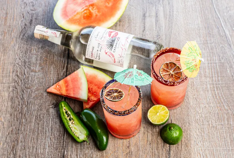 Watermelon tequila cocktails with jalapeños, limes and paper umbrellas